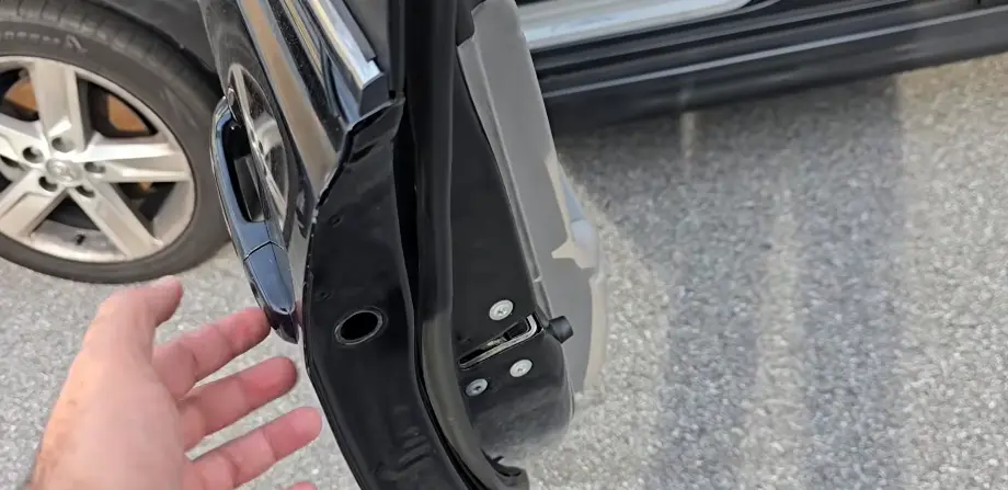 Automotive locksmith servicing a car door lock in Billings, MT