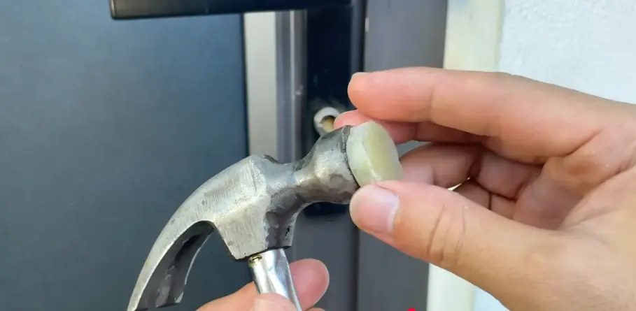 Locksmith repairing a door lock with hand tools in Billings, MT