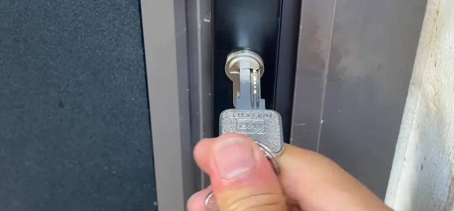 Hand inserting a key into a residential door lock in Billings, MT