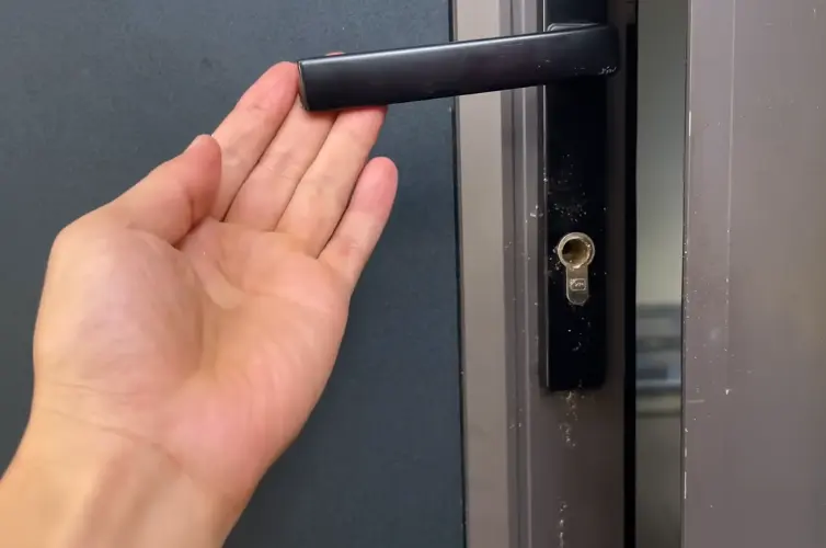 Commercial locksmith fitting a lock on an office door in Billings, MT
